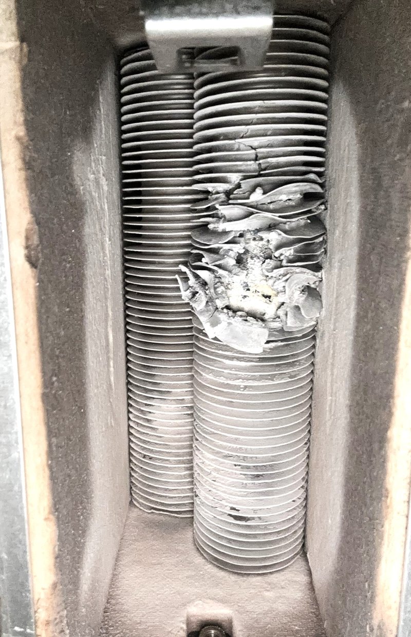 Damaged heat exchanger found inside a warm air unit