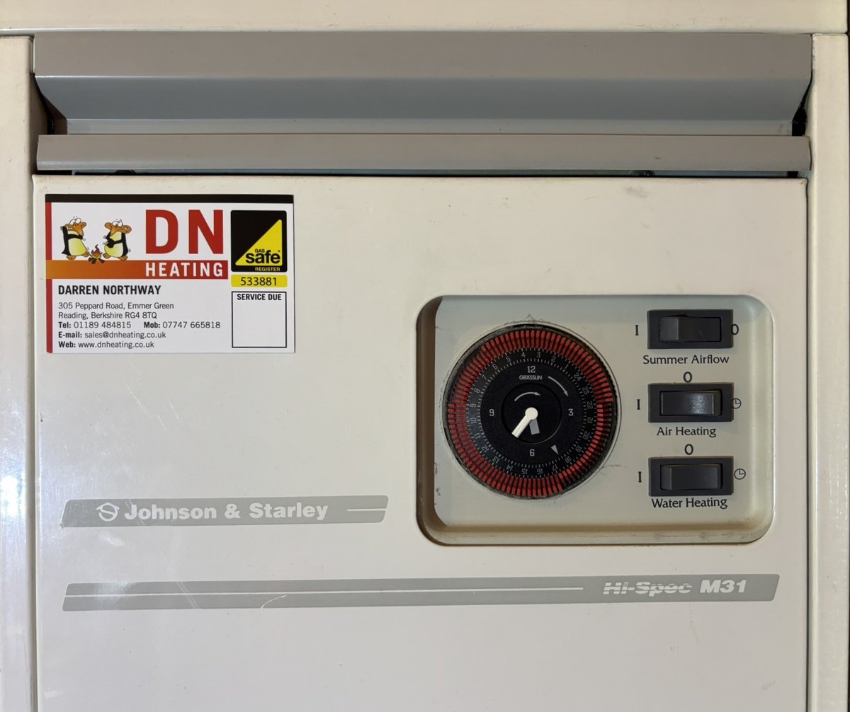 Johnson and Starley Hi-Spec M31 warm air unit with a DN Heating service sticker